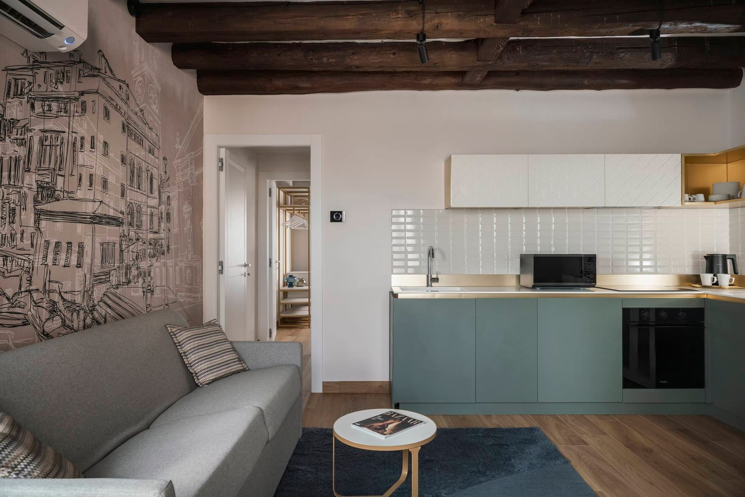Detail of fully equipped kitchen and sofa, Classic Apartment with canal view