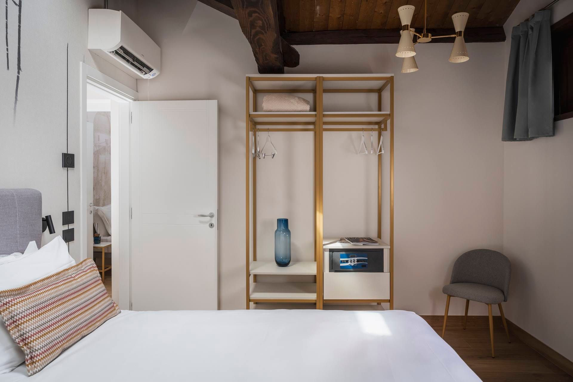 Classic Apartment, Palazzo dei Guardiani, detail of bedroom with double bed and split air conditioner
