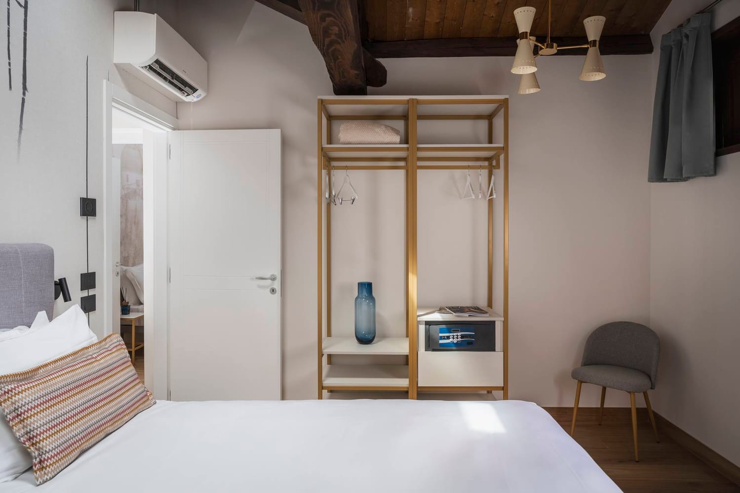 Classic Apartment, Palazzo dei Guardiani, detail of bedroom with double bed and split air conditioner