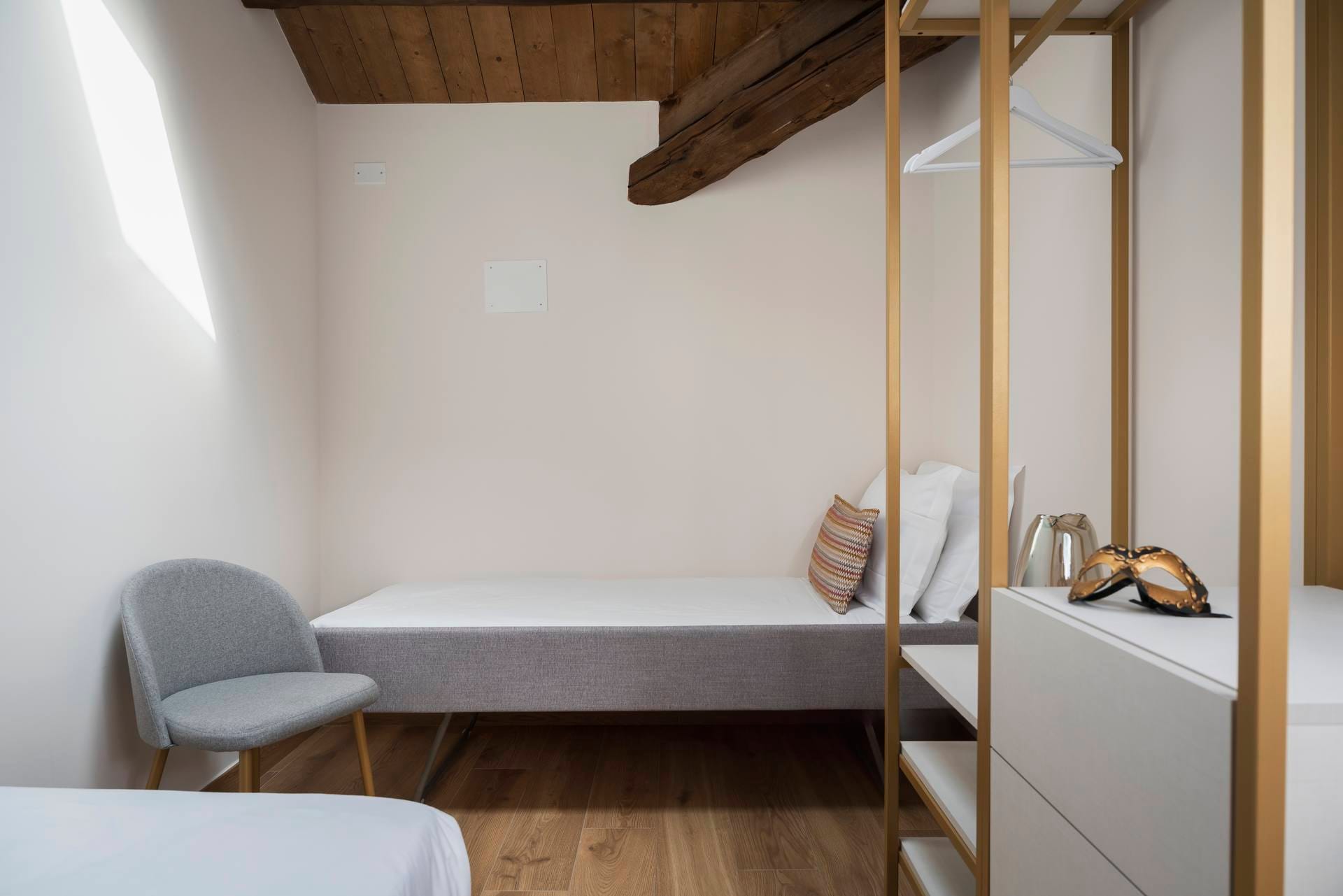 Detail of the second bedroom with extra bed in the Classic Apartment, Palazzo dei Guardiani, Venice