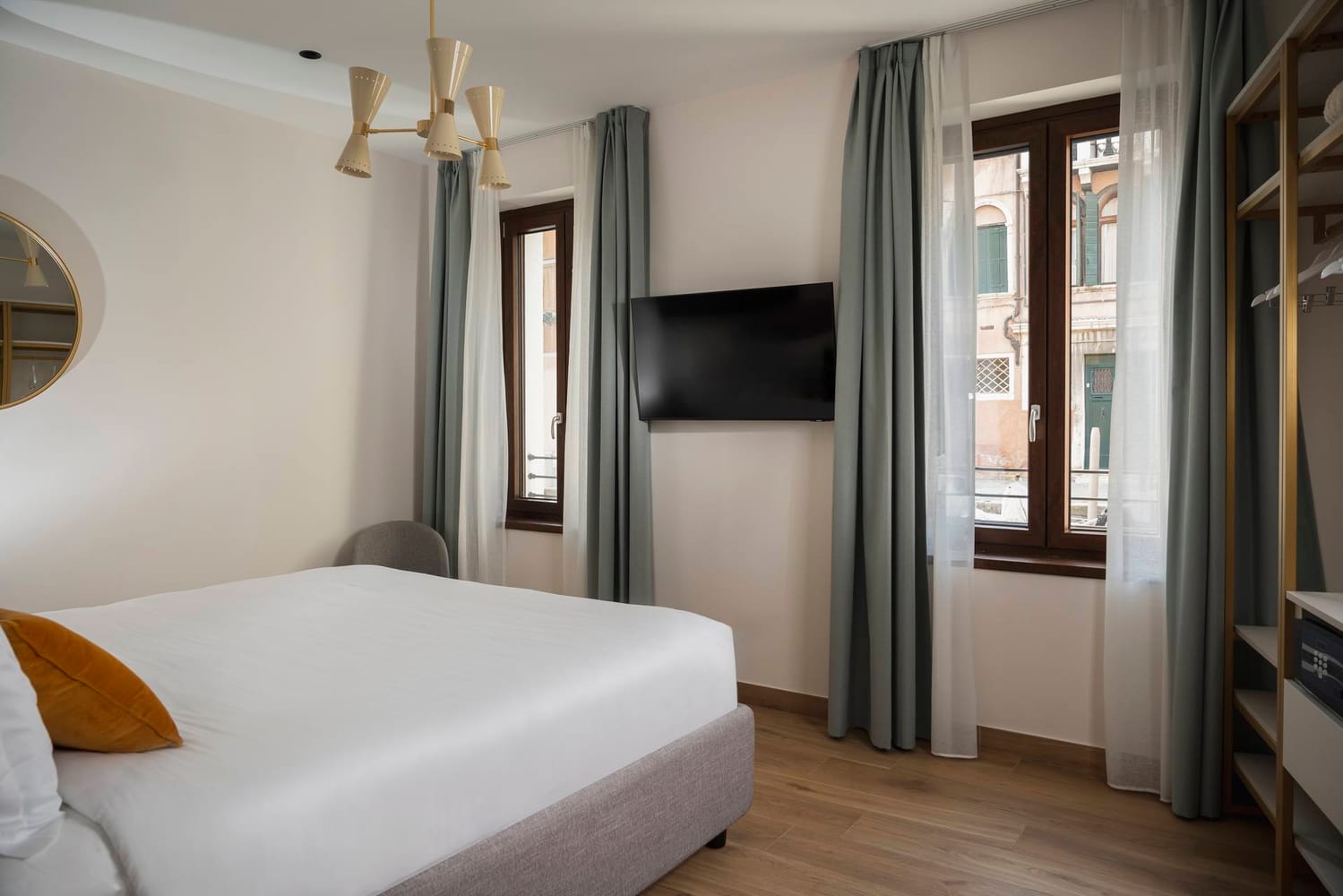 Spacious bedroom with double bed, window, and flat-screen TV, Classic Apartment with canal view