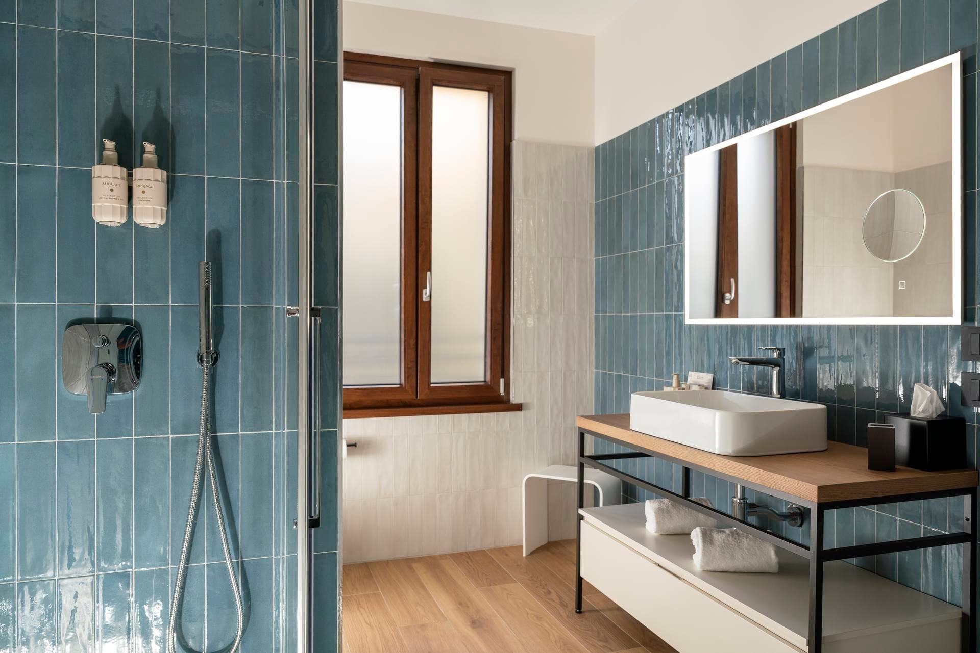 Detail of bathroom with window and shower cubicle, Comfort Apartment