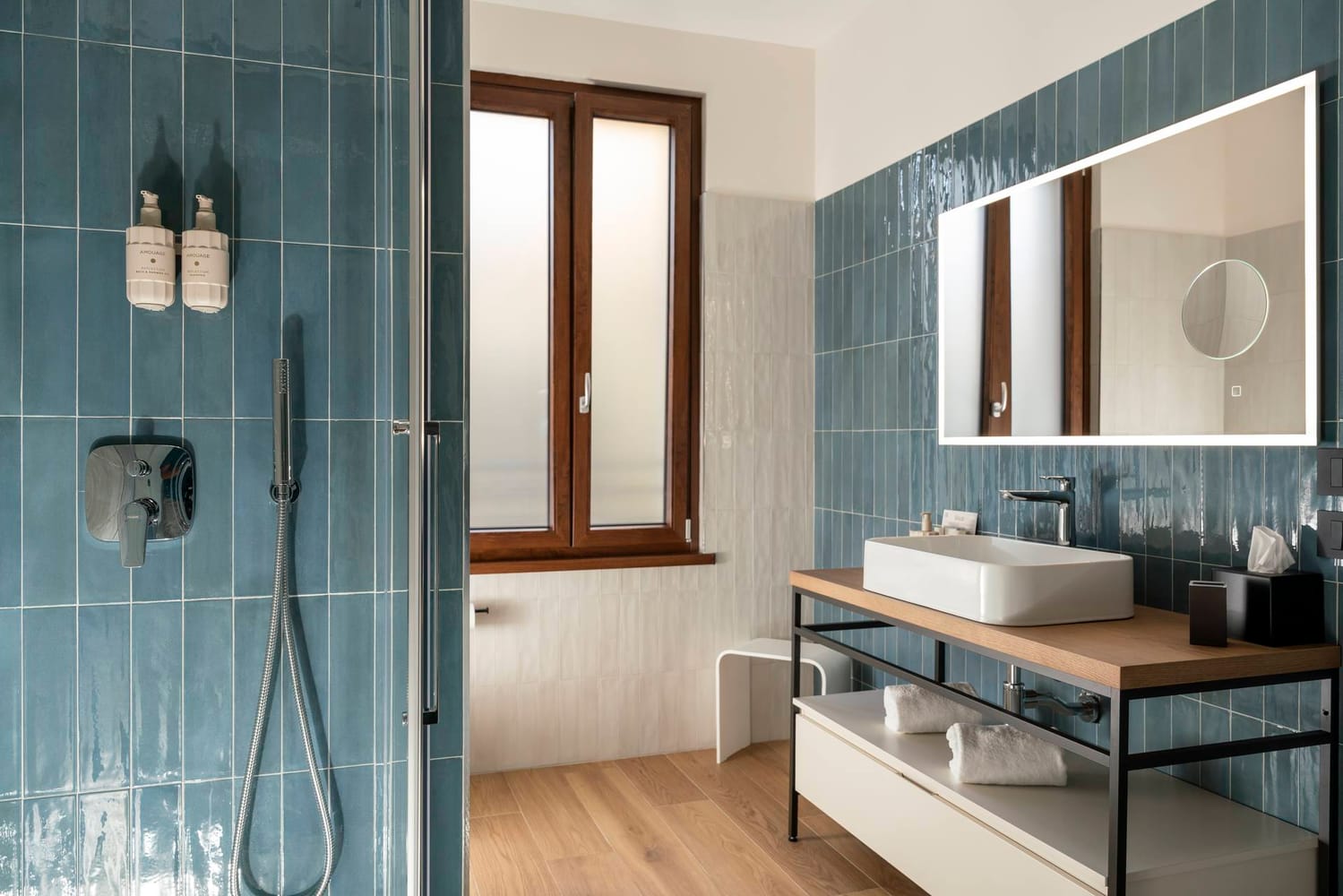 Detail of bathroom with window and shower cubicle, Comfort Apartment