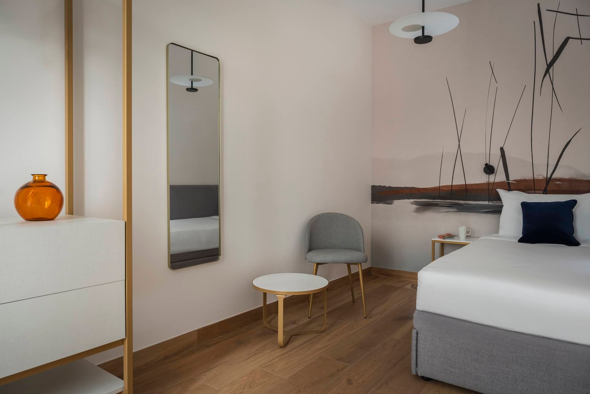 Detail of double bedroom with wall mirror and wardrobe, Superior Apartment with Canal View