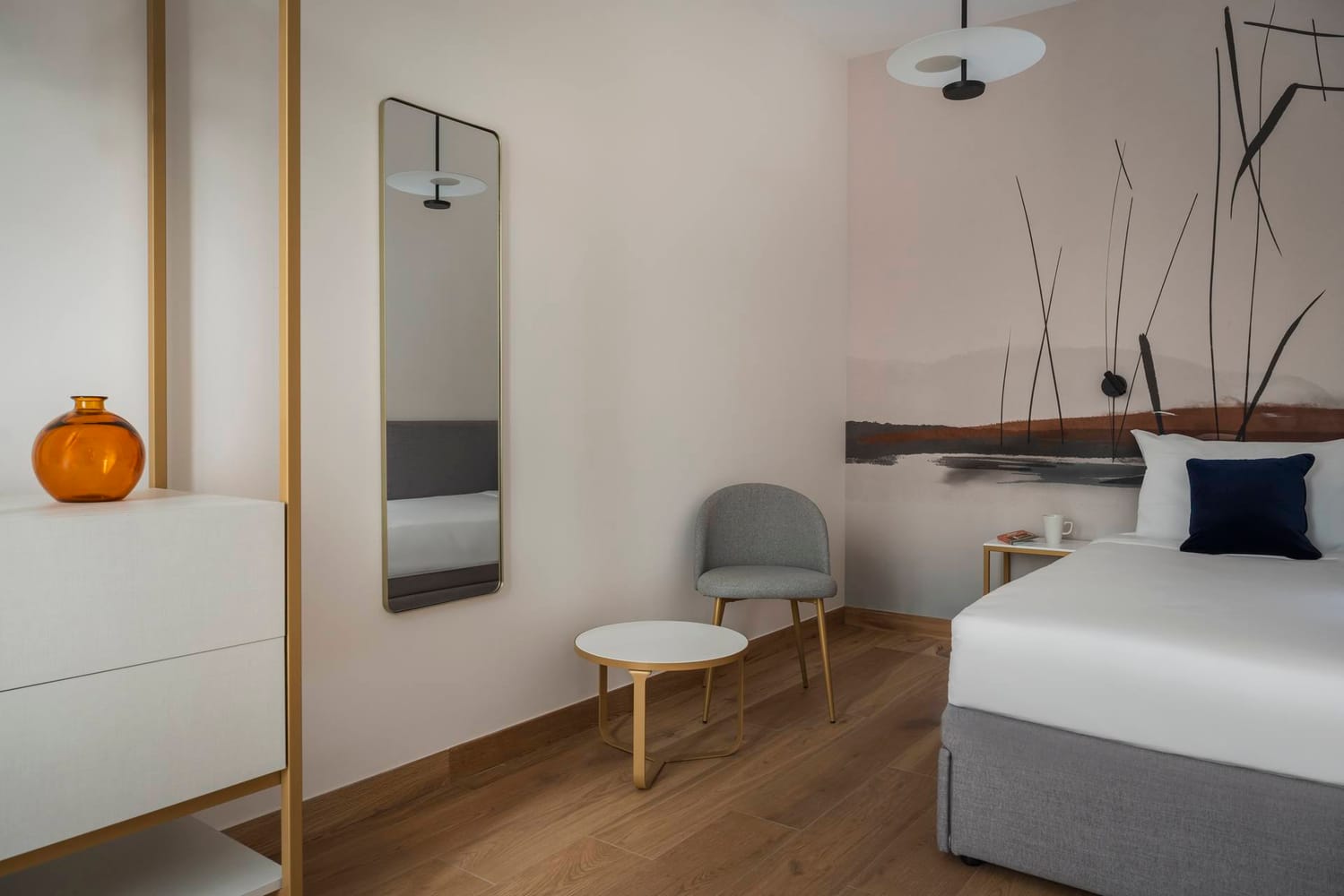 Detail of double bedroom with wall mirror and wardrobe, Superior Apartment with Canal View