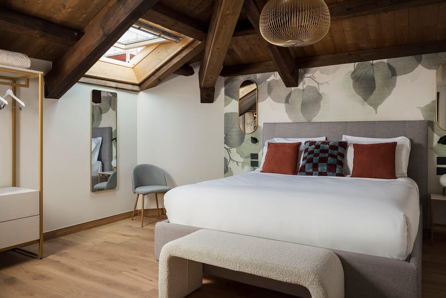 Double bedroom with open wardrobe and skylight window, Palazzo dei Guardiani, Venice
