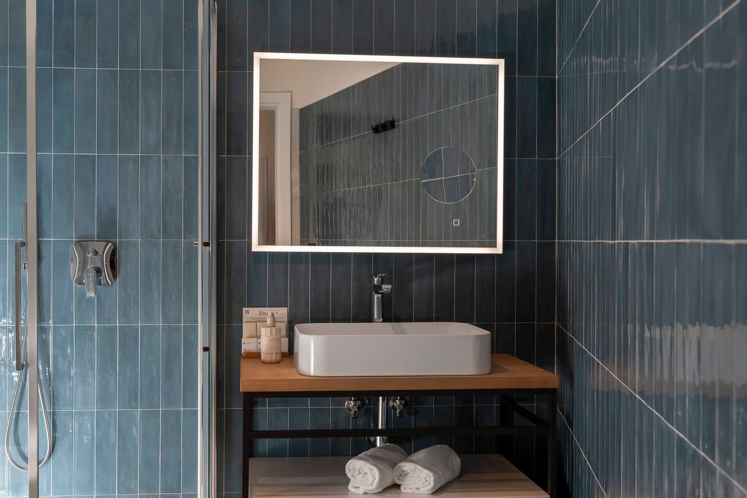 Detail of bathroom with sink and shower cubicle, Classic Apartment with canal view